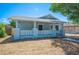 Charming single-story home boasts a welcoming front porch and well-maintained landscaping at 202 W Hancock St, Lakeland, FL 33803