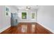 Bright living room features hardwood floors, a decorative fireplace, and natural light at 202 W Hancock St, Lakeland, FL 33803