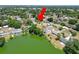 An aerial view highlighting a house near a lake, showcasing waterfront living at 2103 Sylvester Ct, Lakeland, FL 33803