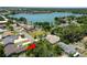 Aerial view of houses by a lake with lush greenery and a serene neighborhood ambiance at 2103 Sylvester Ct, Lakeland, FL 33803