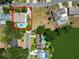 Aerial view of house with pool and mature trees in quiet residential neighborhood at 2103 Sylvester Ct, Lakeland, FL 33803