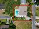 Aerial shot of home with a swimming pool, surrounded by trees and a fenced yard at 2103 Sylvester Ct, Lakeland, FL 33803