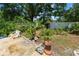Landscaped garden area with decorative rocks and tropical plants at 2103 Sylvester Ct, Lakeland, FL 33803
