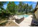 A relaxing backyard is set up for barbecuing, conversation by the fire, or sunbathing by the pool at 2103 Sylvester Ct, Lakeland, FL 33803