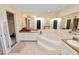 Bathroom featuring a jacuzzi tub, tiled floor, shower, and double sinks at 2103 Sylvester Ct, Lakeland, FL 33803