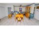 Dining room features a ceiling fan, tile flooring, and adjacent pantry closet at 2103 Sylvester Ct, Lakeland, FL 33803