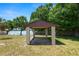 Lakeside gazebo with shaded space overlooking the water, perfect for relaxation and views at 2103 Sylvester Ct, Lakeland, FL 33803
