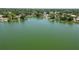 Scenic lake view showing calm water surrounded by lush greenery, promoting tranquility at 2103 Sylvester Ct, Lakeland, FL 33803