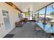 Enclosed lanai with patio furniture, fans, and views of the community, perfect for relaxing and entertaining at 2103 Sylvester Ct, Lakeland, FL 33803