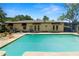 A private backyard swimming pool offers a refreshing escape, surrounded by a patio, landscaping, and the home's exterior at 2103 Sylvester Ct, Lakeland, FL 33803