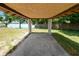 View from under a lakeside gazebo showing lake scenery and concrete base at 2103 Sylvester Ct, Lakeland, FL 33803