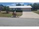 Charming single-story home with well-manicured landscaping and a driveway at 2213 Eastmeadows Rd, Lakeland, FL 33812