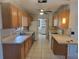Functional kitchen features ample counter space, wooden cabinetry, and standard appliances at 2213 Eastmeadows Rd, Lakeland, FL 33812