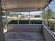 Screened porch with an open view of the front yard and neighborhood at 2213 Eastmeadows Rd, Lakeland, FL 33812