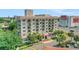 Lovely exterior view of the building highlighting balconies, landscaping, and a well-maintained facade at 235 6Th Nw St # 307, Winter Haven, FL 33881