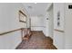 Hallway leading to an elevator, complete with decor and patterned carpeting at 235 6Th Nw St # 307, Winter Haven, FL 33881