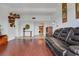 The living room features hardwood floors, modern décor, and is connected to the kitchen at 235 6Th Nw St # 307, Winter Haven, FL 33881