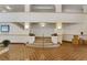Inviting lobby area featuring decorative columns, tiled flooring, and grand staircase at 235 6Th Nw St # 307, Winter Haven, FL 33881