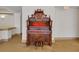 Elegant lobby featuring a wooden pump organ and stool at 235 6Th Nw St # 307, Winter Haven, FL 33881