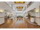 Expansive lobby with high ceilings, tiled floors, decorative columns, and ample natural light at 235 6Th Nw St # 307, Winter Haven, FL 33881