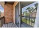 View of balcony with sliding glass door looking out to yard with trees at 2369 Tom Jones St # 8, Orlando, FL 32839