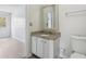 Bathroom featuring vanity with granite countertops and modern white cabinetry at 2369 Tom Jones St # 8, Orlando, FL 32839