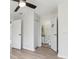Open bedroom with entryways to a bathroom and closet at 2369 Tom Jones St # 8, Orlando, FL 32839