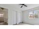 Bright bedroom featuring a window and closet space at 2369 Tom Jones St # 8, Orlando, FL 32839