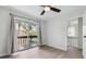 Bedroom with a sliding glass door that provides access to the balcony at 2369 Tom Jones St # 8, Orlando, FL 32839