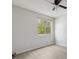Bright bedroom with hardwood floors, a ceiling fan, and a window offering natural light at 2369 Tom Jones St # 8, Orlando, FL 32839