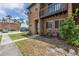 Image shows the exterior of a red brick condo, a charming balcony, and simple landscaping at 2369 Tom Jones St # 8, Orlando, FL 32839