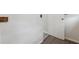 Hallway with hardwood floors leads to a door, providing access to other rooms at 2369 Tom Jones St # 8, Orlando, FL 32839