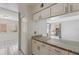 Bright kitchen featuring granite countertops and white cabinetry, offering a clean and modern aesthetic at 2369 Tom Jones St # 8, Orlando, FL 32839