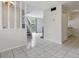 Open living space showcasing tile flooring, stairs to the second level, and sliding door access to the outside at 2369 Tom Jones St # 8, Orlando, FL 32839