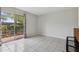 Bright living room with sliding glass doors leading to a fenced yard with tile flooring at 2369 Tom Jones St # 8, Orlando, FL 32839