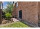 Brick patio with sliding glass doors and adjacent green lawn for relaxation and entertainment at 2369 Tom Jones St # 8, Orlando, FL 32839