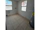 This is a room with two windows and tile floors at 2610 Eaton Ave, Lakeland, FL 33803