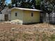 This is a small yellow shed in a state of disrepair at 2610 Eaton Ave, Lakeland, FL 33803