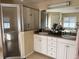 Bright bathroom with a glass-enclosed shower, double vanity sinks, and ample counter space at 2663 Brookside Bluff Loop, Lakeland, FL 33813