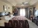 Charming bedroom with a tray ceiling, plush carpet, and a decorative cheetah print throw blanket at 2663 Brookside Bluff Loop, Lakeland, FL 33813