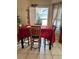 Cozy dining room featuring a dining table with seating and bright natural light from the windows at 2663 Brookside Bluff Loop, Lakeland, FL 33813
