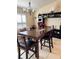 Inviting dining room with a modern chandelier and stylish decor on the display shelves at 2663 Brookside Bluff Loop, Lakeland, FL 33813