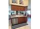 Beautiful kitchen boasts updated cabinets, stainless steel appliances, and functional bar seating area at 2663 Brookside Bluff Loop, Lakeland, FL 33813
