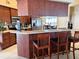 Stylish kitchen featuring bar seating, stainless steel appliances, and light countertops at 2663 Brookside Bluff Loop, Lakeland, FL 33813