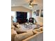 Relaxing living room with a plush sofa, armchair, and a large TV perfect for entertaining at 2663 Brookside Bluff Loop, Lakeland, FL 33813