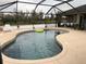 Relaxing backyard pool features a screened enclosure and sunning area for ultimate outdoor enjoyment at 2663 Brookside Bluff Loop, Lakeland, FL 33813