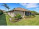 Features a screened lanai, complemented by lush landscaping and well-maintained lawn at 2743 Verandah Vue Way, Lakeland, FL 33812