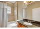 Bathroom featuring a shower/tub combo, single sink vanity, and tile backsplash at 2743 Verandah Vue Way, Lakeland, FL 33812