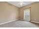 Bright bedroom featuring a ceiling fan, large window, and neutral wall color, showing spaciousness at 2743 Verandah Vue Way, Lakeland, FL 33812