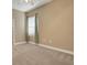 A neutral bedroom with a window and blinds, showing off the spaciousness at 2743 Verandah Vue Way, Lakeland, FL 33812